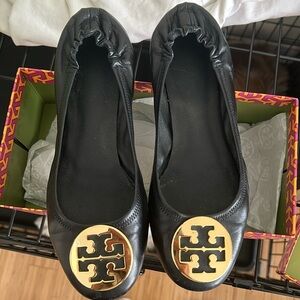 Tory Burch Reva black and gold flat. Size 10. Pre-worn.